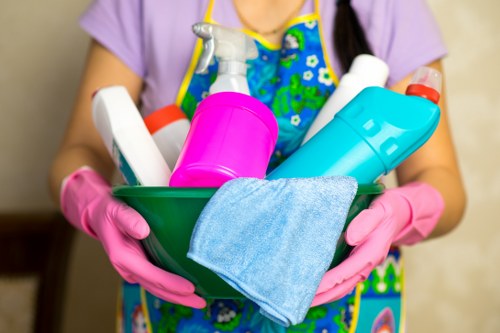 Staff handling cleaning materials safely