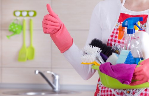 Local cleaner working in a Camden flat with narrow access