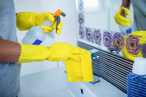 Cleaner preparing a kitchen and bathroom in Camden